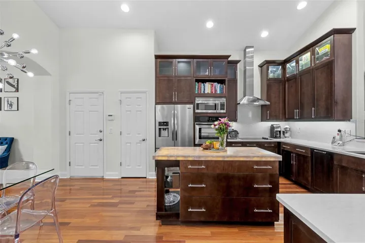 Kitchen island offers prep space, storage, and casual functionality.