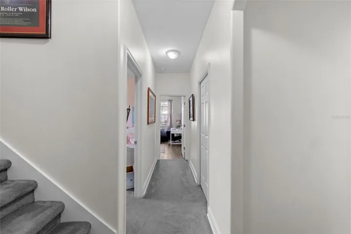 Hallway view connecting bedrooms and living spaces.