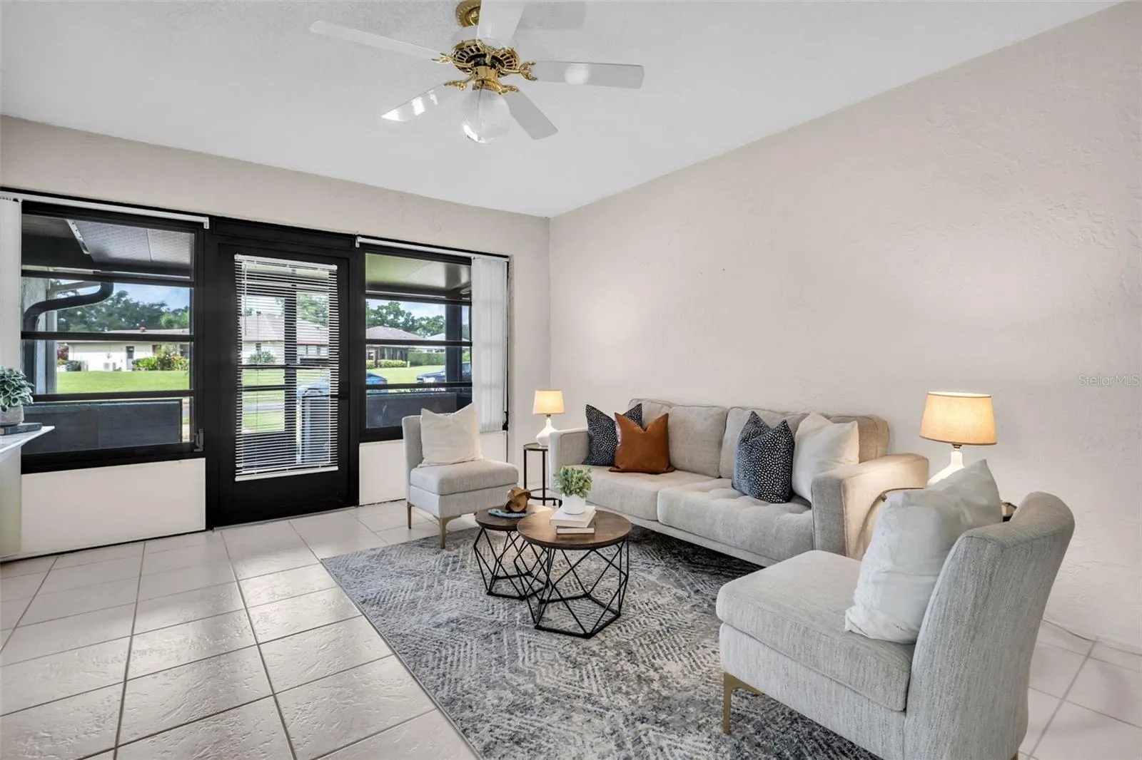 Large front windows allow natural light to flood the space~