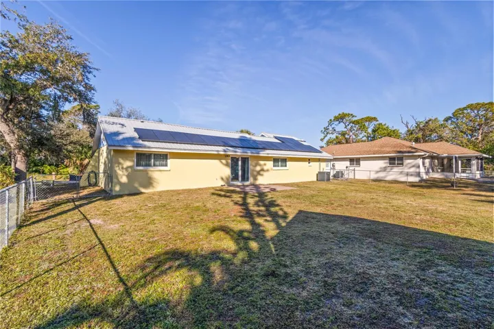 View of solar on roof and this huge backyard that is just full of possiblities!