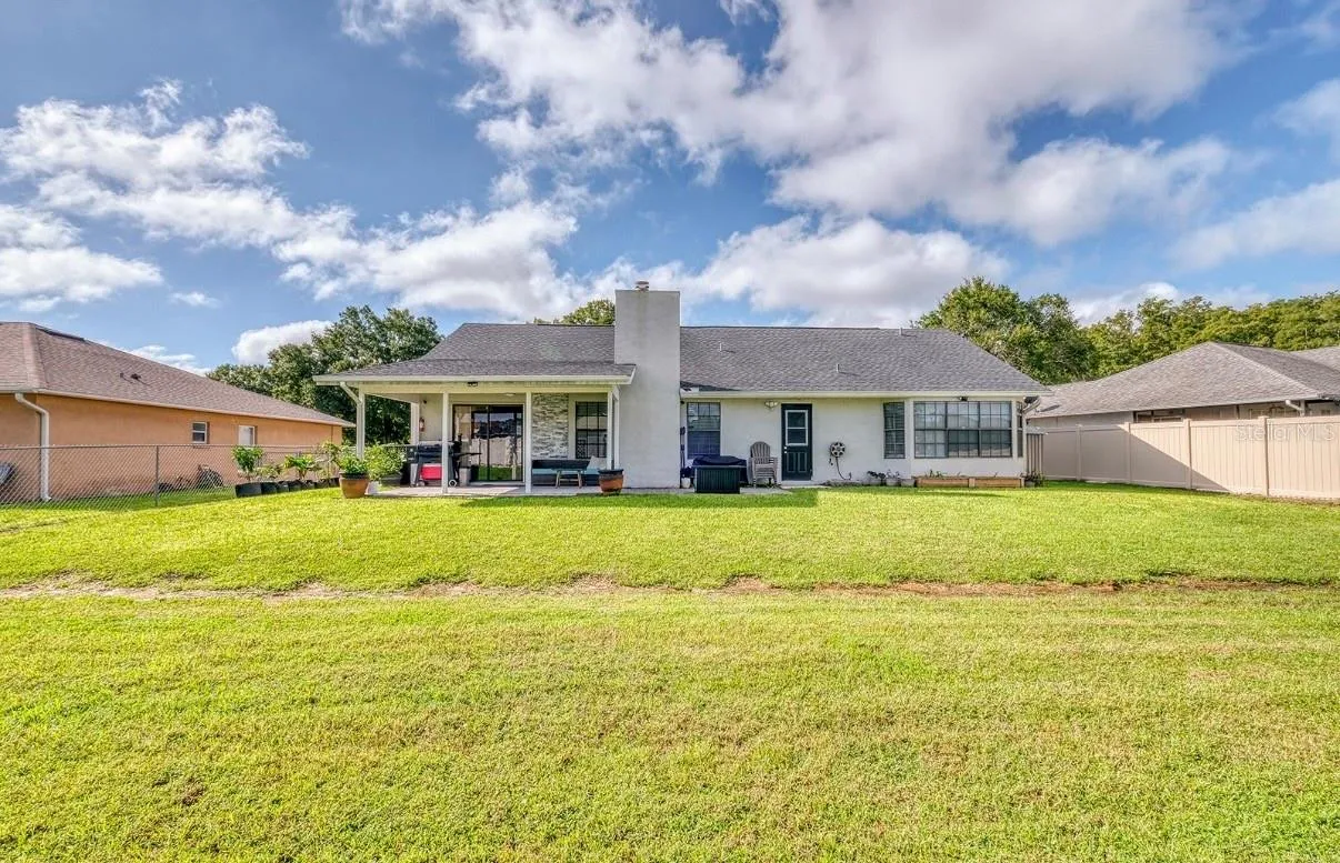 Large Back Yard .26 (1/4+ acre) Line in grass is from fence relocation