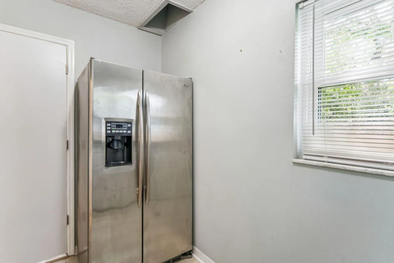 Refrigerator is included and is in the laundry room. Over the refrigerator is a laundry chute located in the guest bedroom closet.