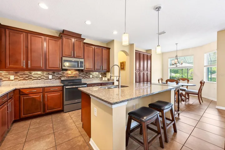 The Kitchen island has room for counter-height seating and offers extra prep space.