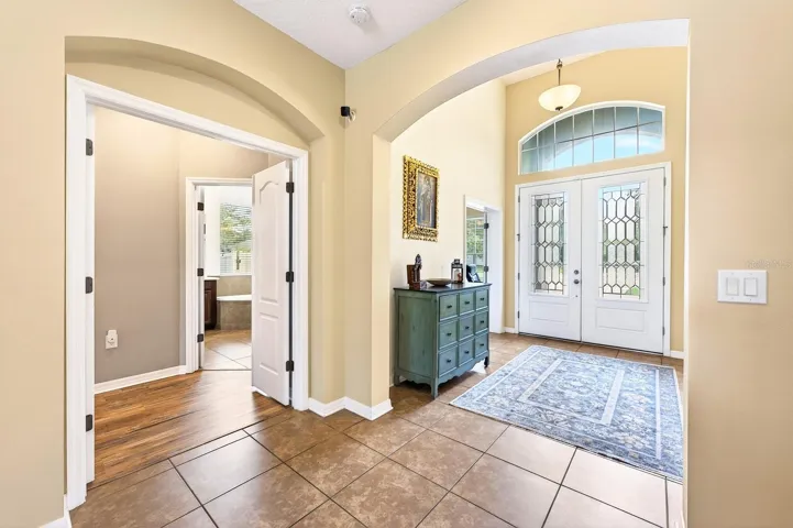 French doors open to the luxurious Primary Suite.