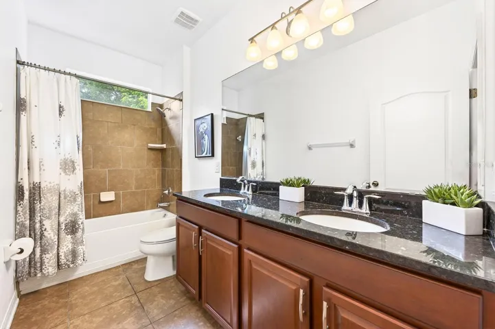 THREE ADDITIONAL LARGE BEDROOMS and two full Baths, one with pool access, provide plenty of room for family and guests.