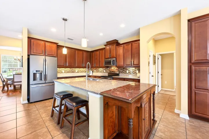The Kitchen island has room for counter-height seating and offers extra prep space.