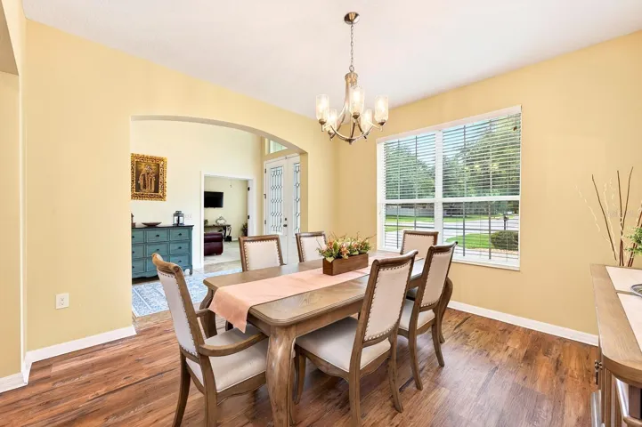 For more formal gatherings, a separate Dining Room with LUXURY VINYL PLANK FLOORING offers an elegant space for hosting family and friends.