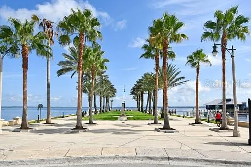 Sanford Riverwalk — a scenic waterfront promenade lined with palms and open views of Lake Monroe.