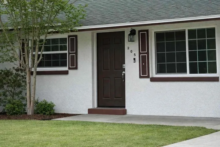 Beautifully refreshed front exterior with updated paint, shutters, and welcoming curb appeal.