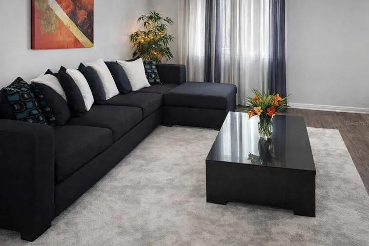 Bright and inviting living room with modern finishes and abundant natural light.