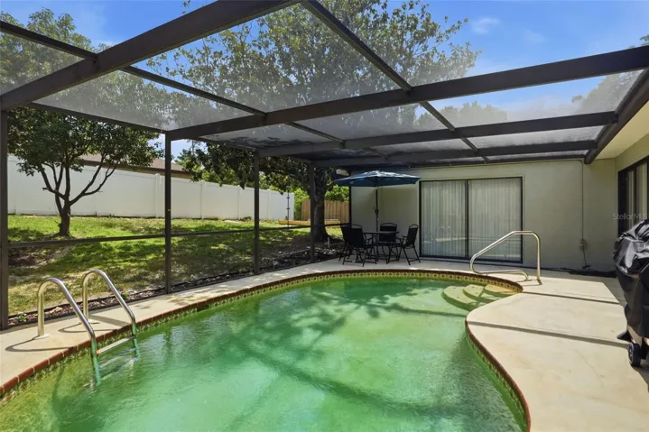 Private pool. Screen enclosure. Needs resurfacing.