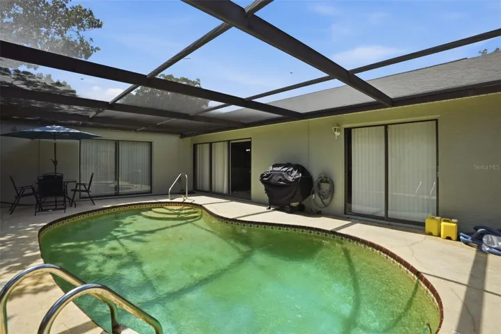 Private pool. Screen enclosure. Needs resurfacing.