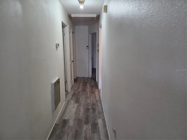 Hallway has vinyl looring