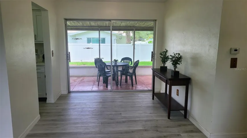 Dinette area just off the kitchen and view of the screened porch