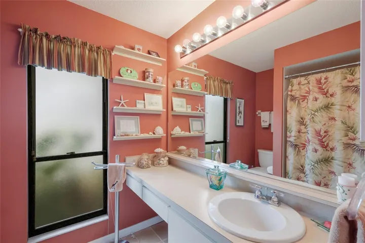 Guest bathroom with make up counter and drawers.