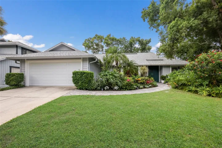 One story beautifully landscaped single family home.