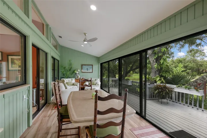 Sun room/4 season lanai/ with new porcelain tile, and high impact sliders.