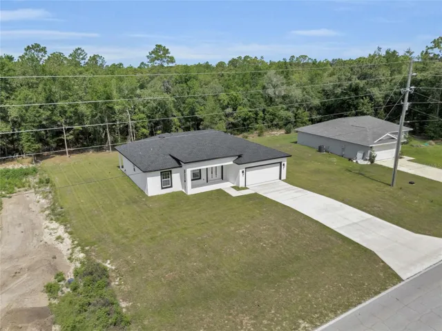 Aerial view of the property and surrounding area