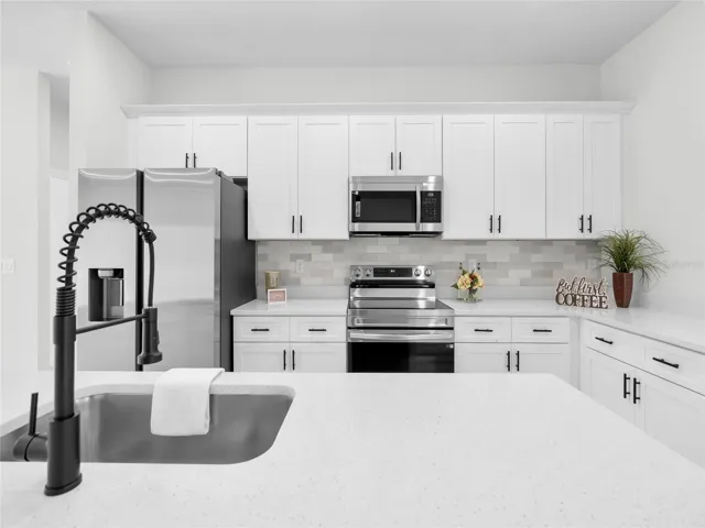 Bright kitchen with modern cabinetry and premium finishes