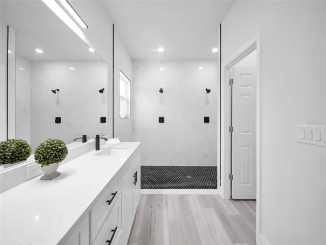 Elegant primary bath with dual vanity and walk-in shower