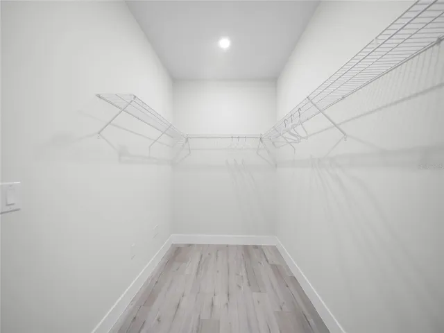 Oversized walk-in closet with custom storage space