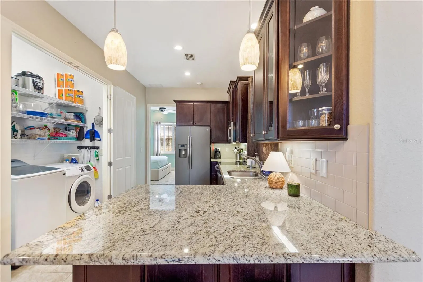 Kitchen with doors open to the laundry closet