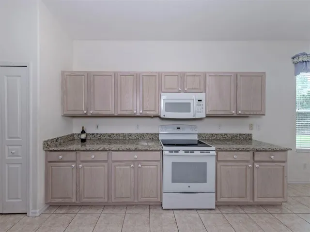 Lots of storage and serving space in this kitchen and it also includes a closet pantry!