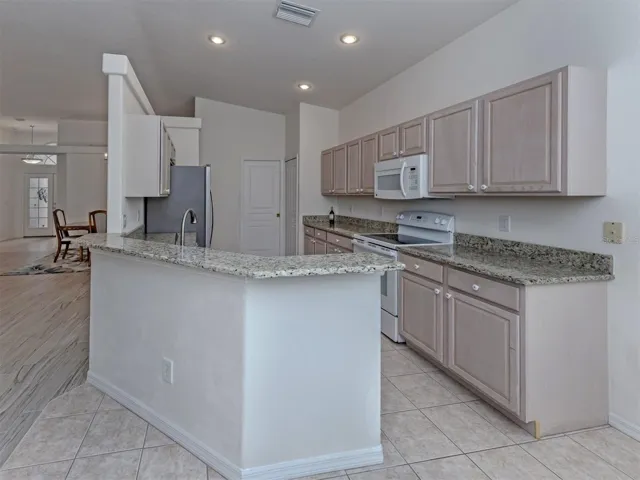 The kitchen includes a nice breakfast bar which is perfect for entertaining guests while the chef prepares the perfect meal