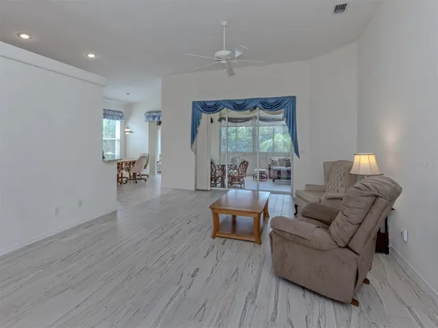 The living room space is large enough to accommodate a large group and perfect place to catch a movie after a day at the beach!