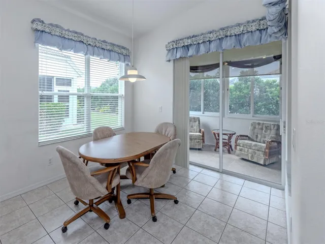 The dinette is just off the kitchen and includes sliding glass doors to the Florida room!