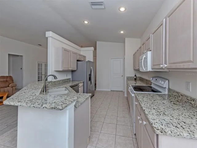 Granite countertops, gently used appliances and lots of storage make this kitchen a chefs dream!