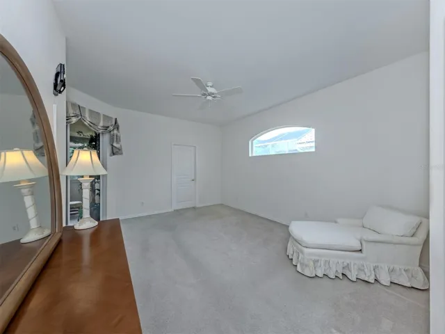 The primary suite is located on the rear of the home and includes a large walk in closet, private ensuite and access the the Florida room