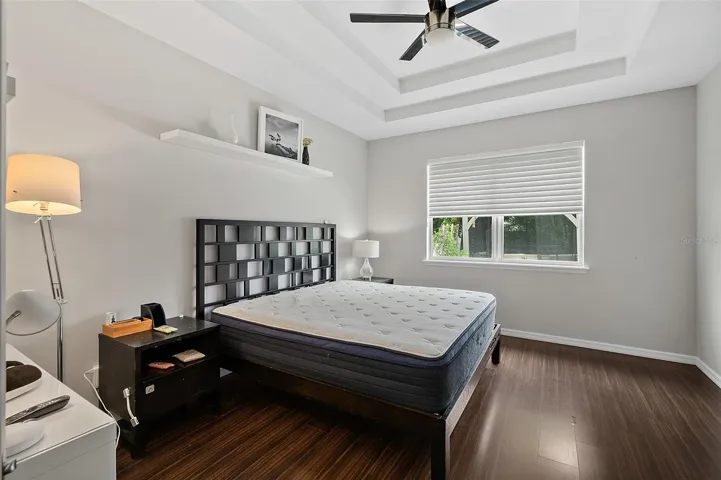 Primary bedroom with cordless honeycomb blinds on the window
