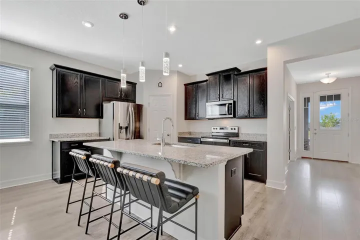 Kitchen with view to foyer.
