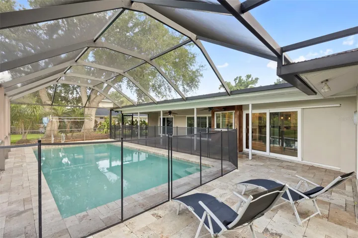 Enclosed in patio with fenced pool