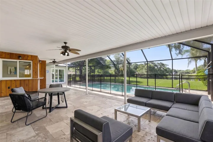 Virtually staged screened in patio setup