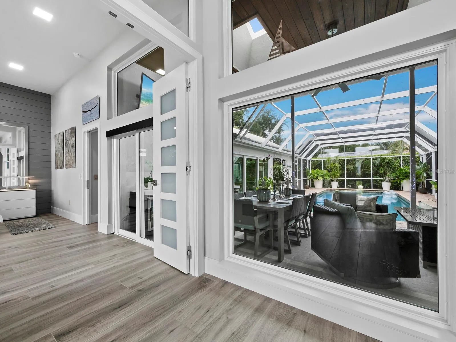 Large custom French doors leading to Primary BR