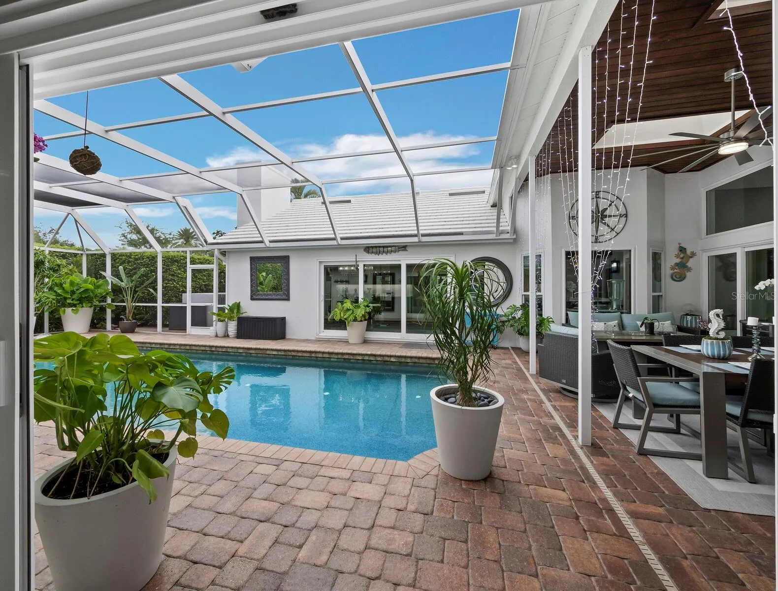 office -view to pool and kitchen/dining