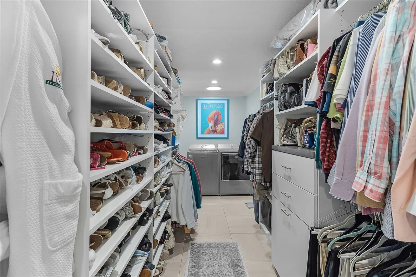 One of the closets, all customized with the washer &amp; dryer right there for your convenience!