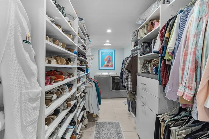 One of the closets, all customized with the washer & dryer right there for your convenience!