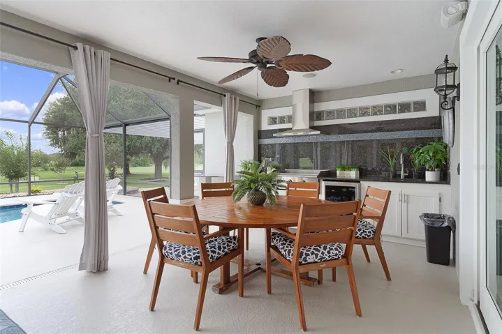 The outside dining area with a beautful oversized outdoor kitchen