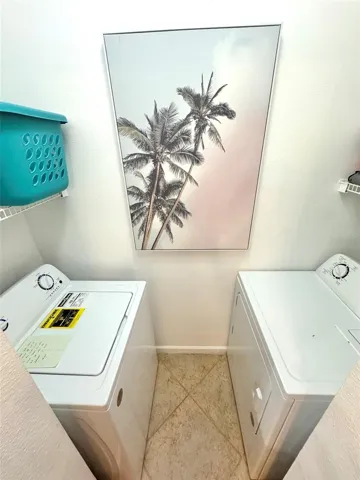 Inside laundry room adjacent to kitchen