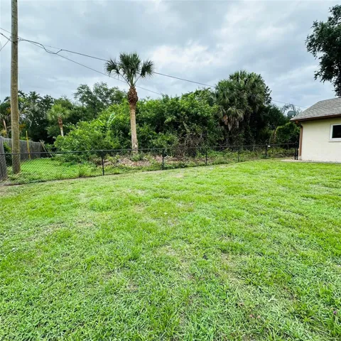 fenced yard, vacant lot next door