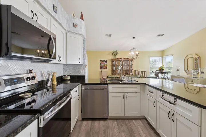 Kitchen with wooden cabinets and pull-outs.