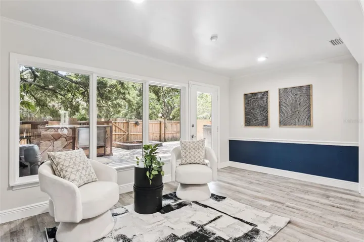 Light filled sitting area perfect for gathering together, set up a play space for the kiddos, or a wonderful home office.