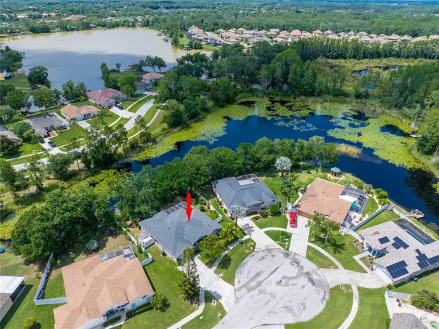 DRONE SHOT OF HOME AND SHOWING LAKE