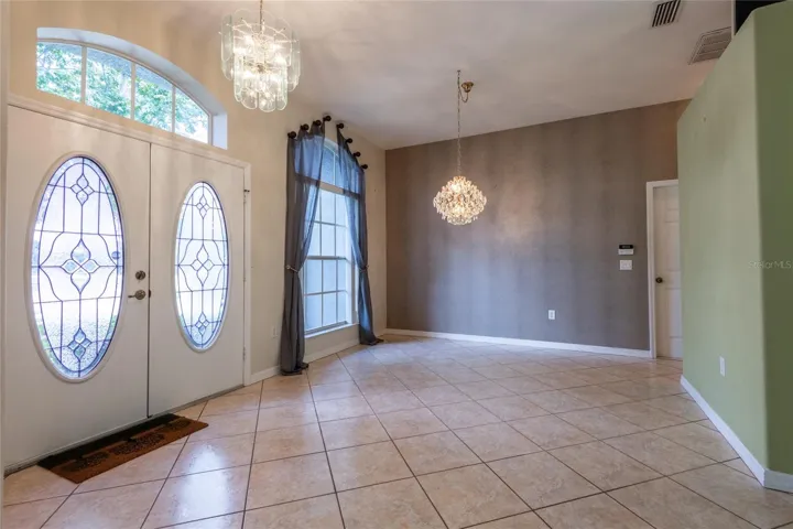 VIEW OF DINING AREA WITH BEAUTIFUL FRONT DOOR VIEW