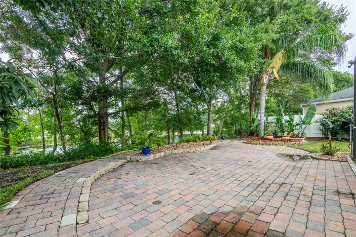 PAVERS LEADING TO DOCK WITH MATURE LANDSCAPING