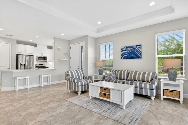 Open concept living space with dining space at kitchen counter