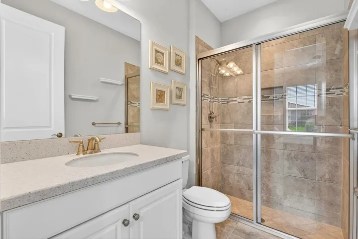 Walk in closet with upgraded gray tile